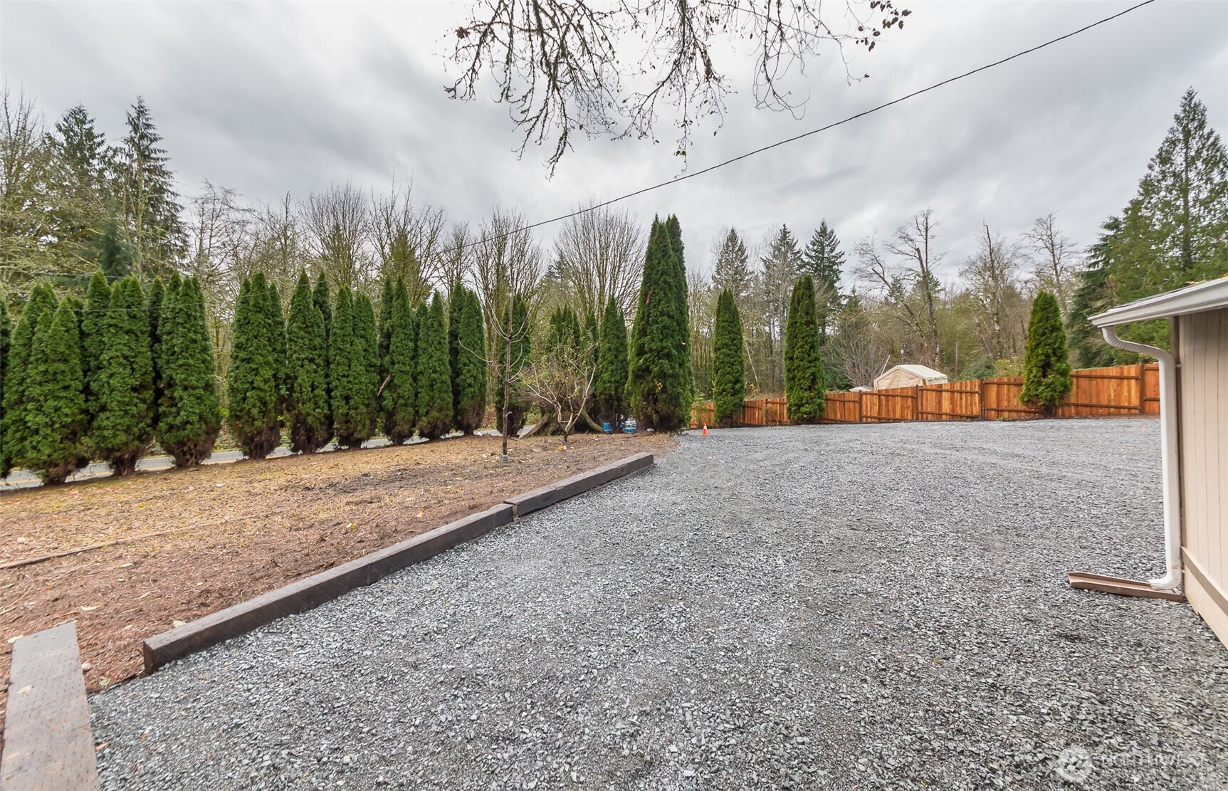 225 North Lake Roesiger Road Snohomish, WA 98290 - Photo 39 of 40 a view of a road with a bench in front of it