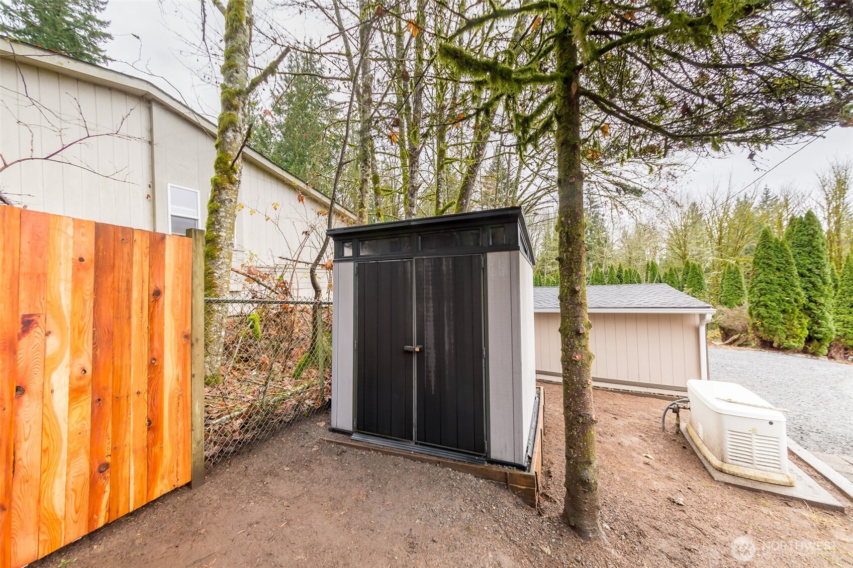 225 North Lake Roesiger Road Snohomish, WA 98290 - Photo 40 of 40 a view of a house with a yard and garage