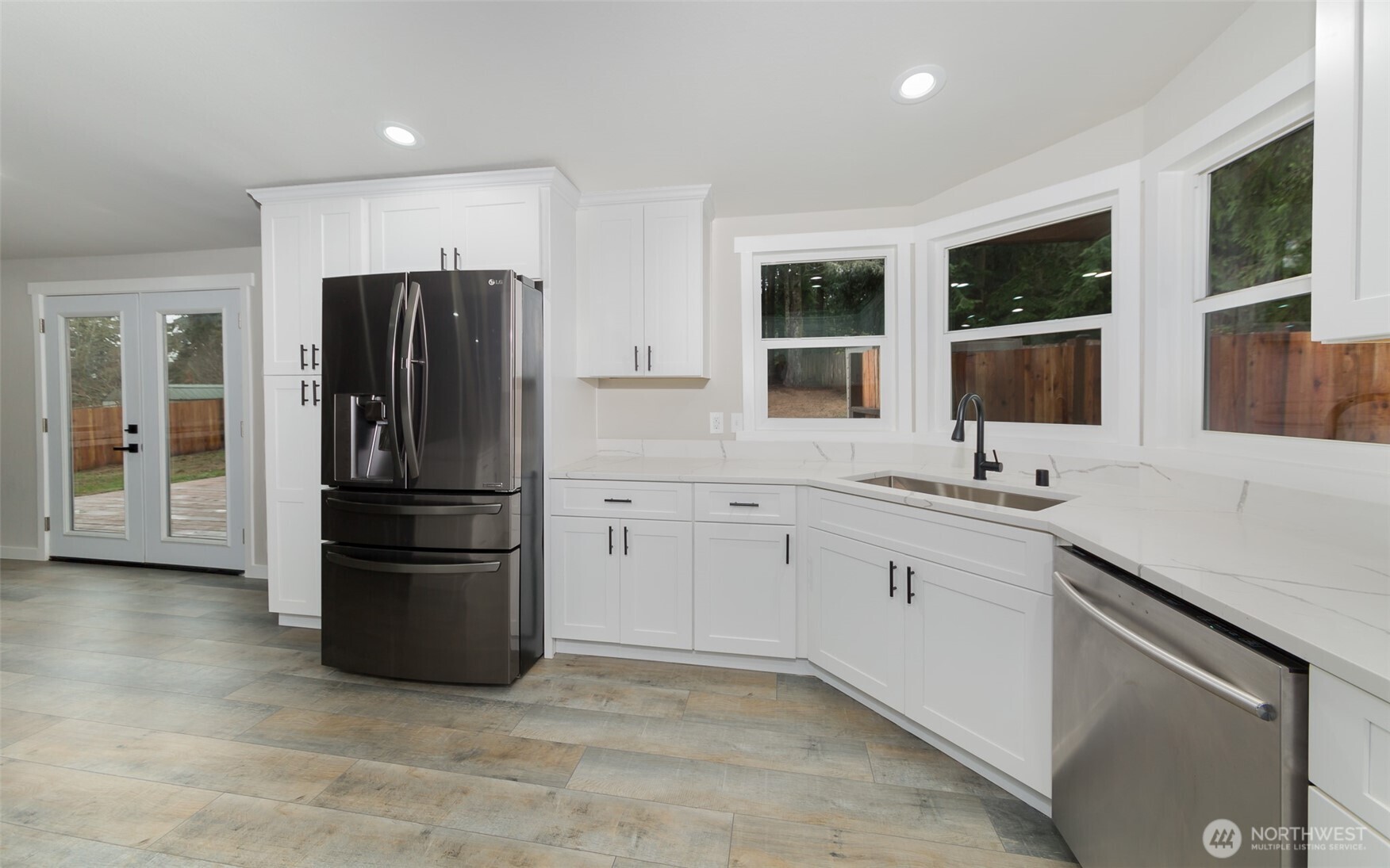 225 North Lake Roesiger Road Snohomish, WA 98290 - Photo 5 of 40 a kitchen with stainless steel appliances a refrigerator stove and sink