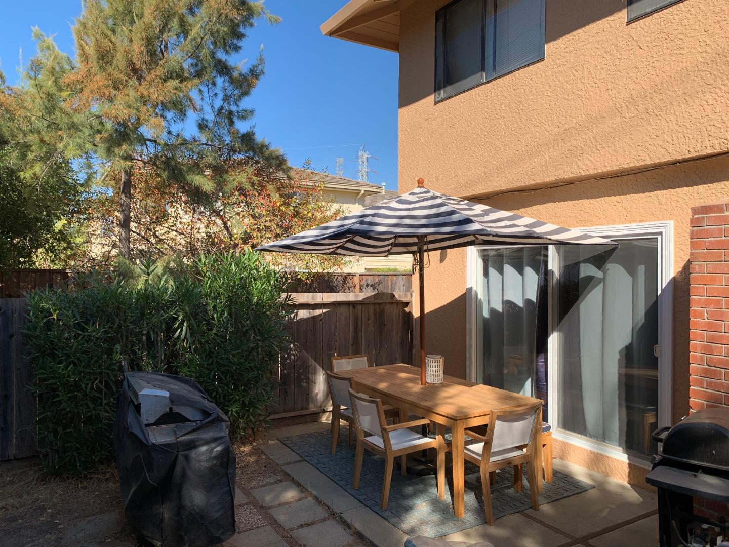 10327 Alpine Drive Cupertino, CA 95014 - Photo 14 of 25 a backyard of a house with outdoor seating