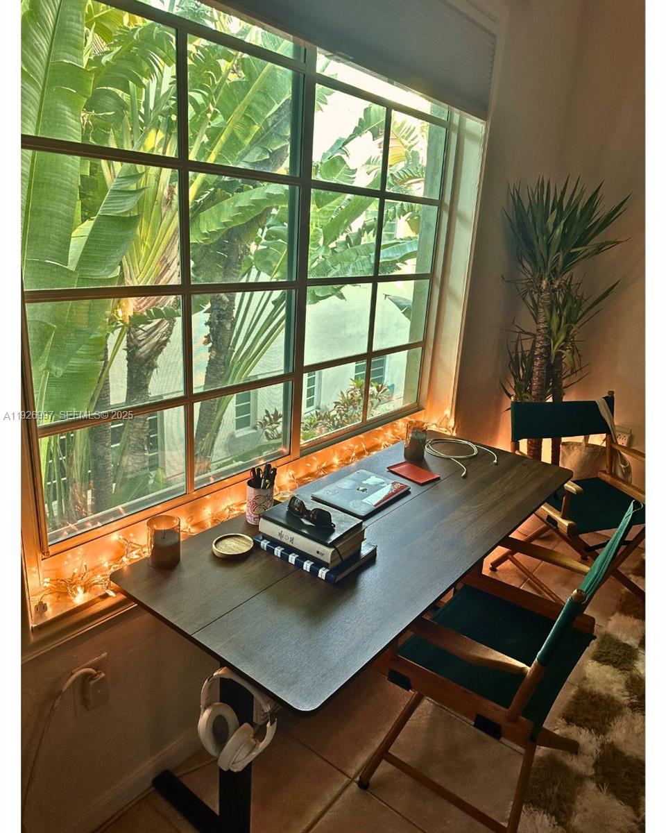 349 Meridian Avenue, Unit B202 Miami Beach, FL 33139 - Photo 13 of 20 a living room with a table