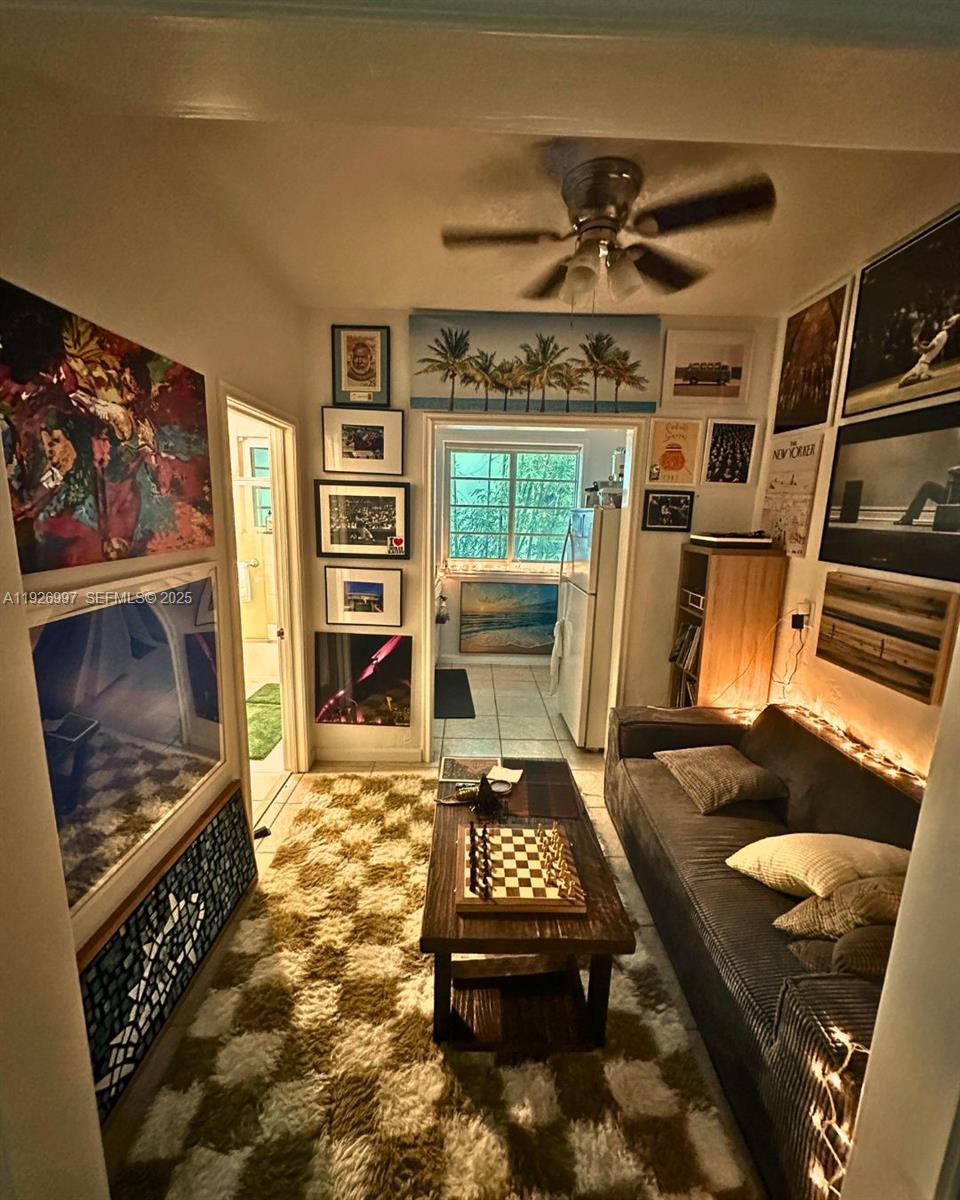 349 Meridian Avenue, Unit B202 Miami Beach, FL 33139 - Photo 15 of 20 a living room with furniture and a flat screen tv
