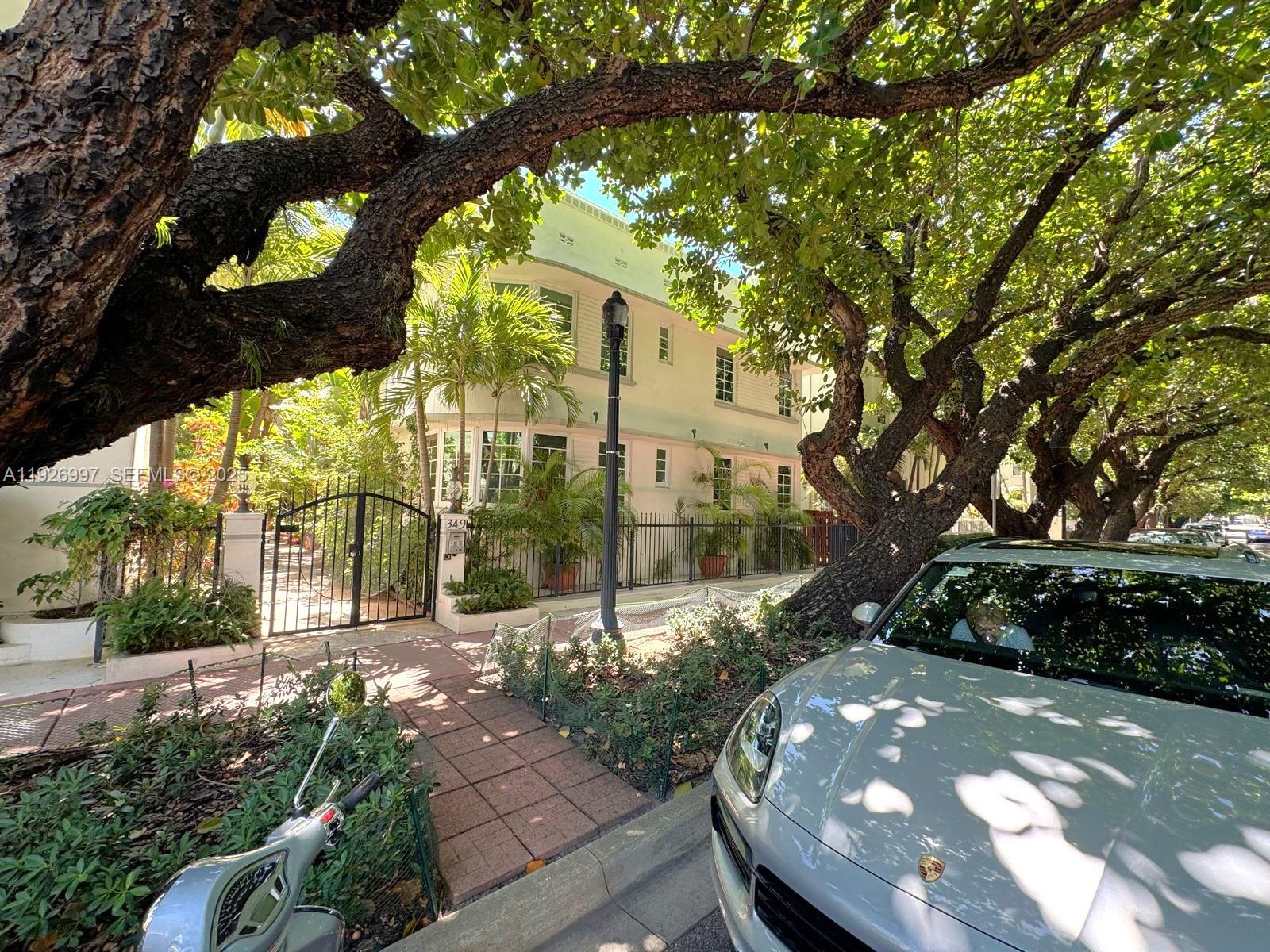 349 Meridian Avenue, Unit B202 Miami Beach, FL 33139 - Photo 3 of 20 a view of a pathway of a house with a tree
