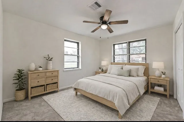 a bedroom with a bed and a dresser