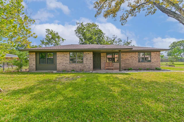 front view of a house with a garden