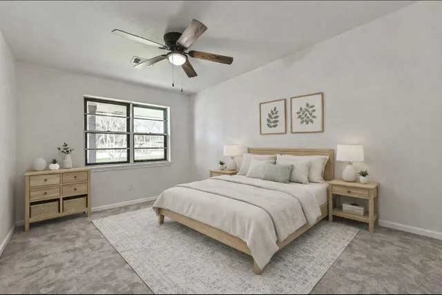 a bedroom with a bed and window