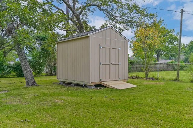 a backyard of a house with lots of green space