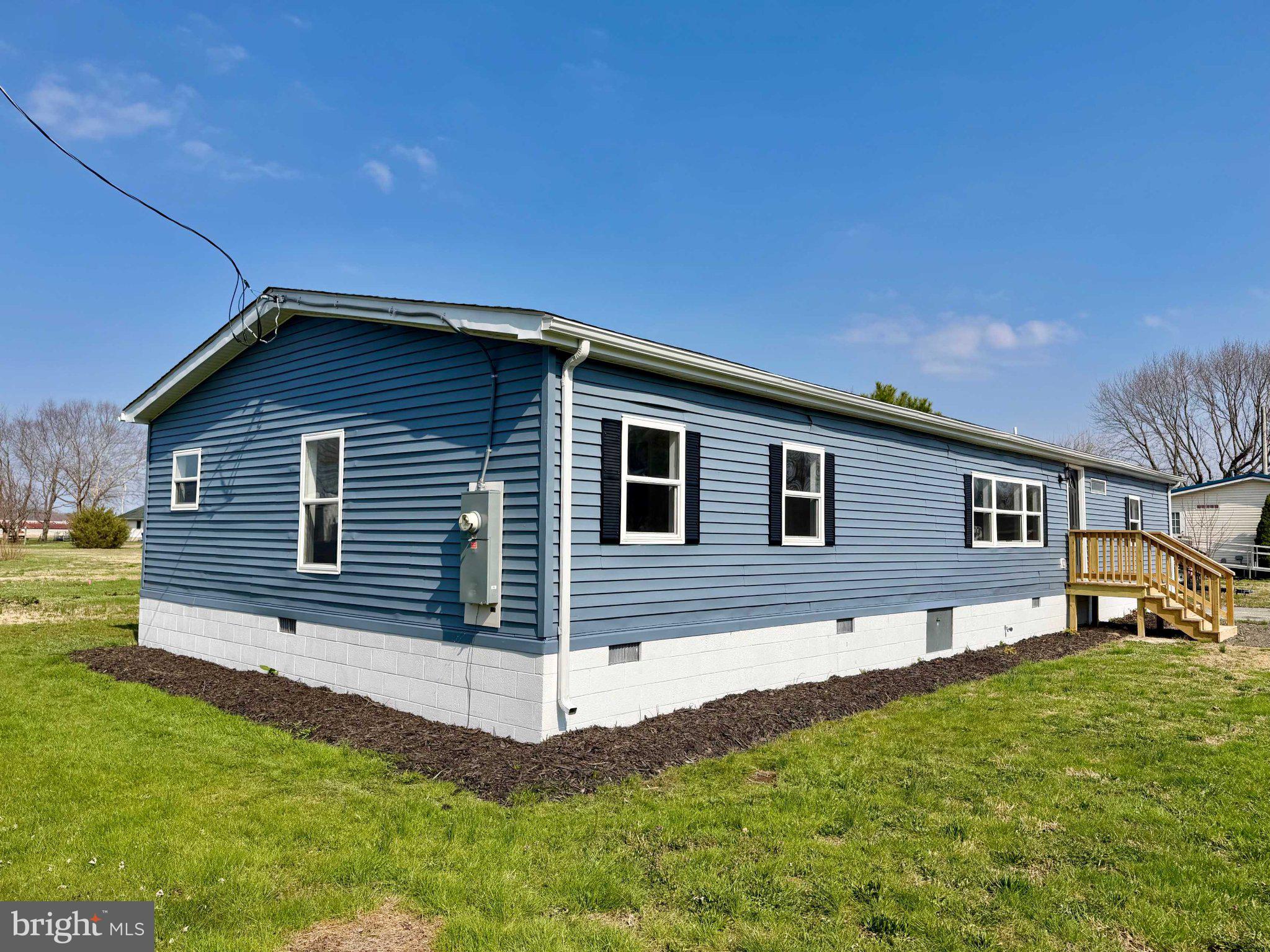 17335 Isdell Road Milford, DE 19963 - Photo 2 of 18 a front view of a house with a yard