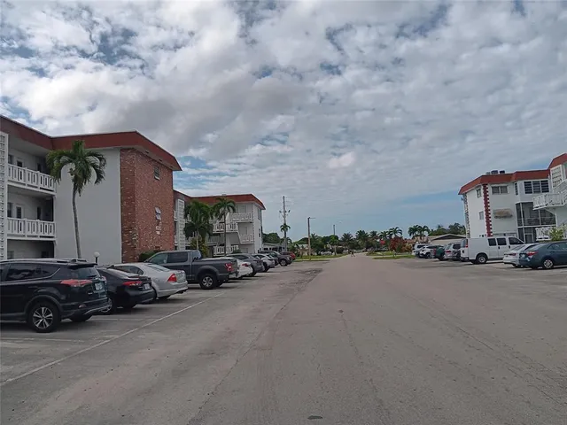 a view of a car parked in front of a building