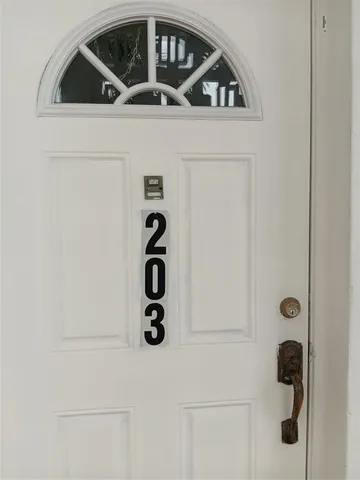 a view of outdoor space with deck and white floor