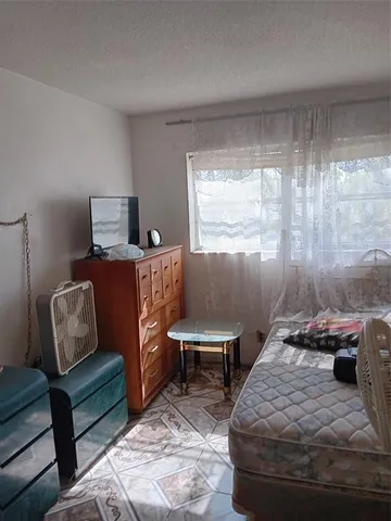 a room with water heater and a window