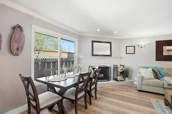 a dining room with furniture and window