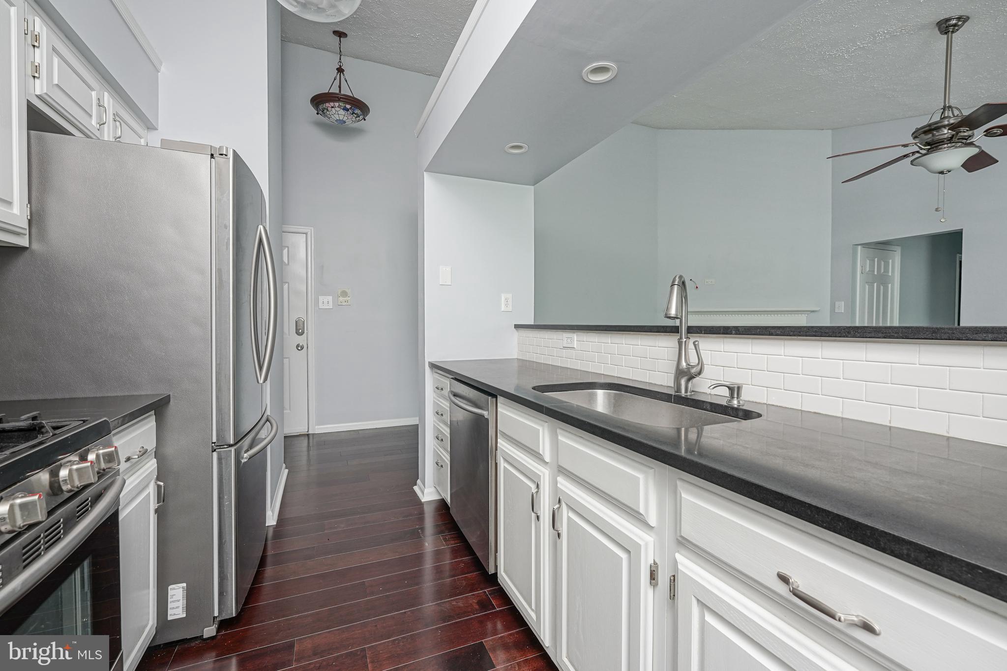 84 Eldon Way Marlton, NJ 08053 - Photo 11 of 27 a kitchen with stainless steel appliances granite countertop a sink and a stove