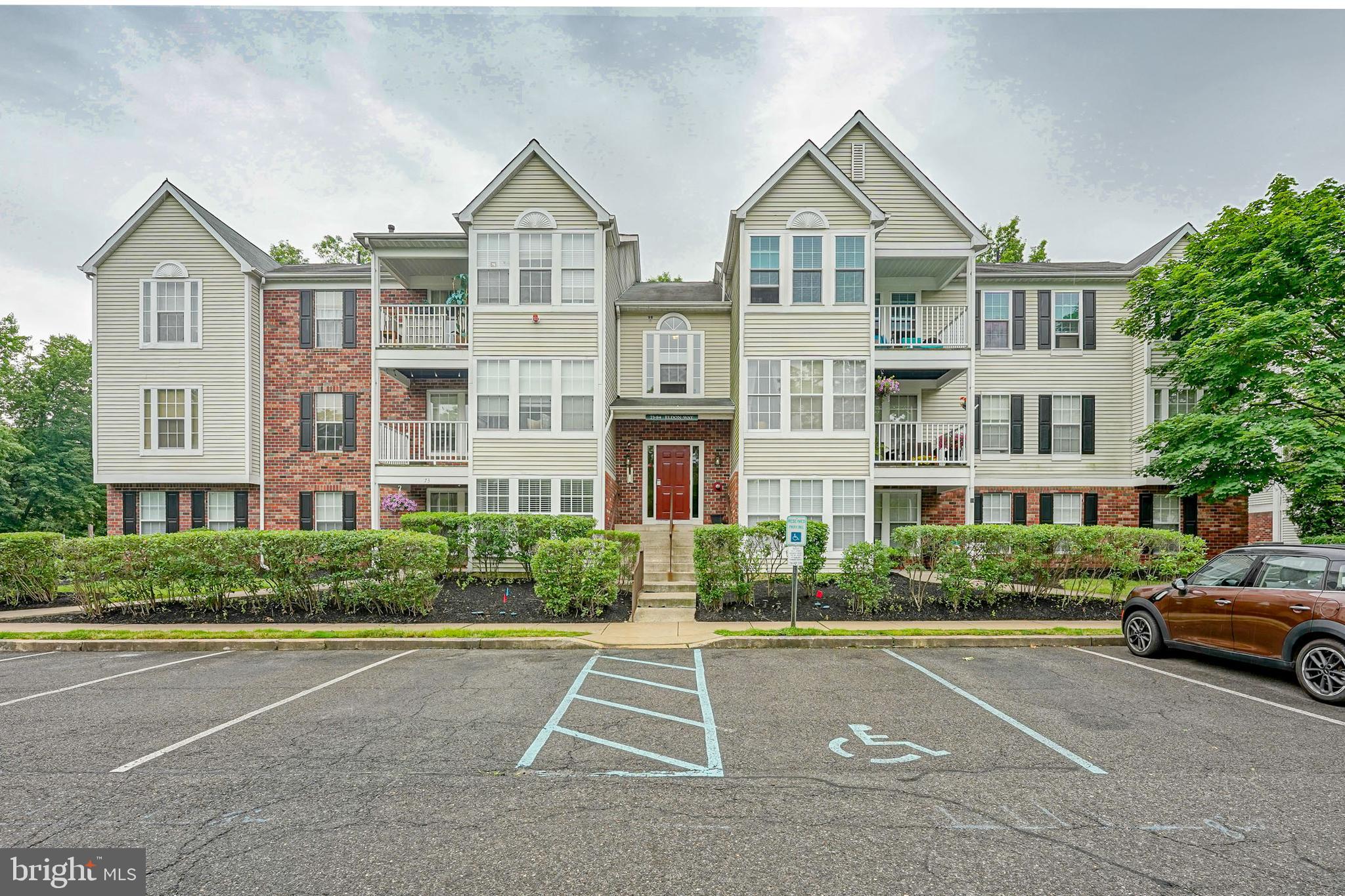 84 Eldon Way Marlton, NJ 08053 - Photo 2 of 27 a front view of a residential apartment building with a yard