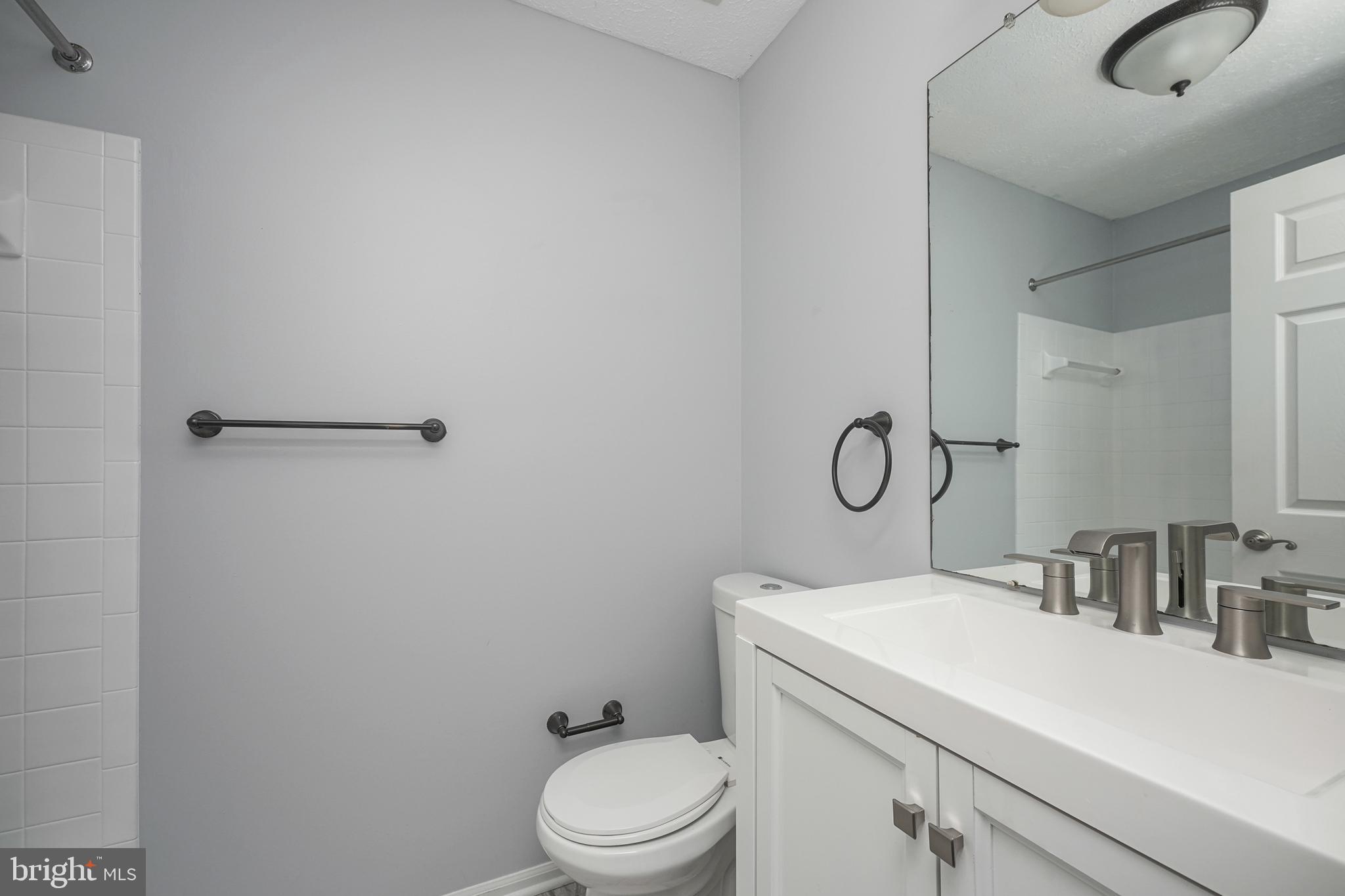 84 Eldon Way Marlton, NJ 08053 - Photo 23 of 27 a bathroom with a toilet sink vanity and tub