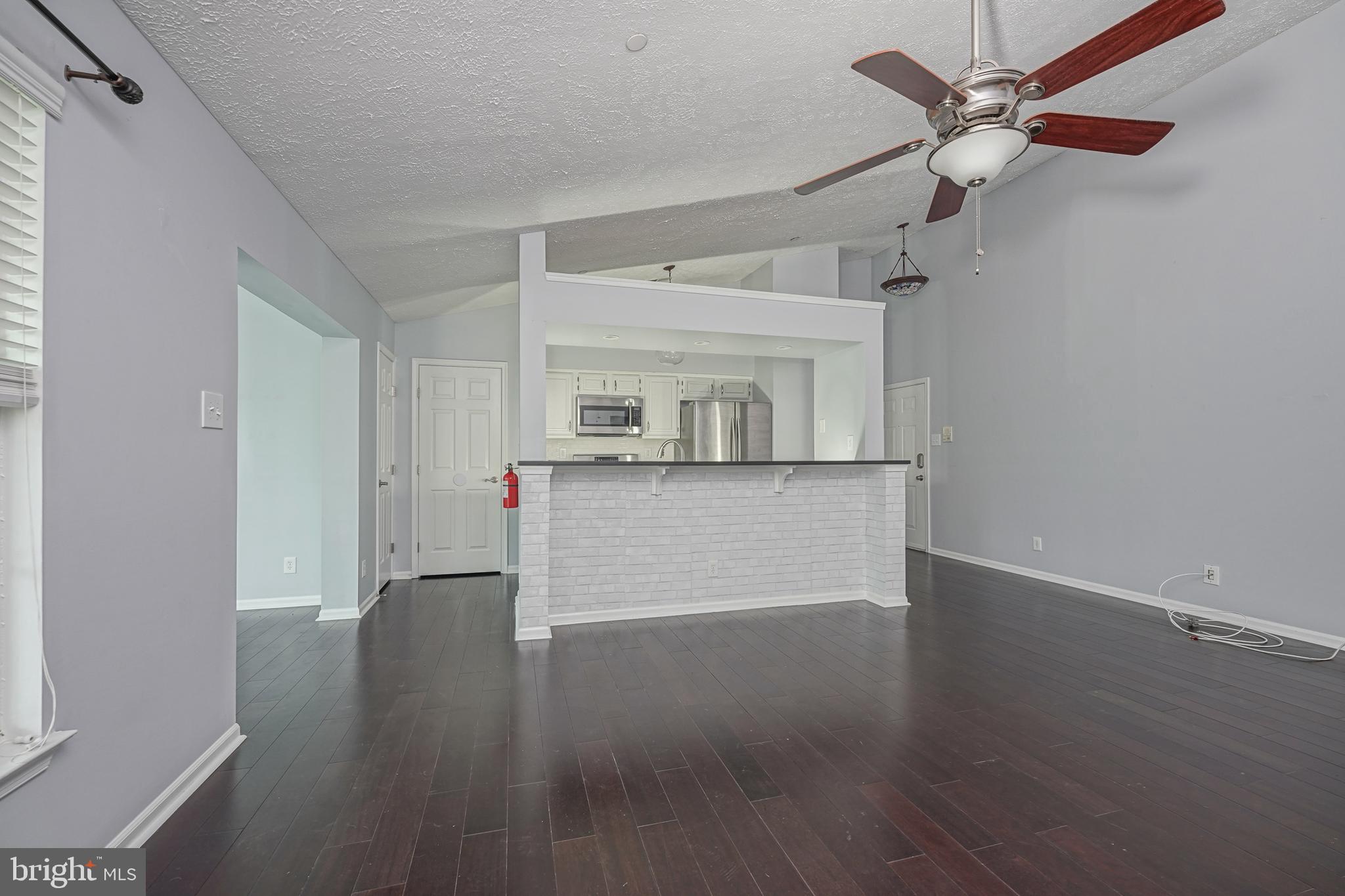 84 Eldon Way Marlton, NJ 08053 - Photo 7 of 27 an empty room with wooden floor and windows