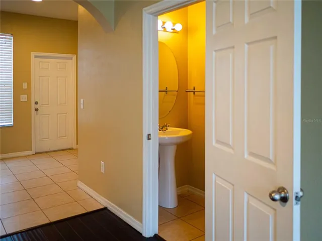 a view of a bathroom with a tub and sink