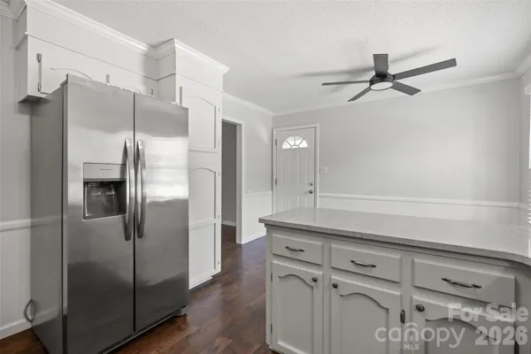 a kitchen with cabinets and stainless steel appliances