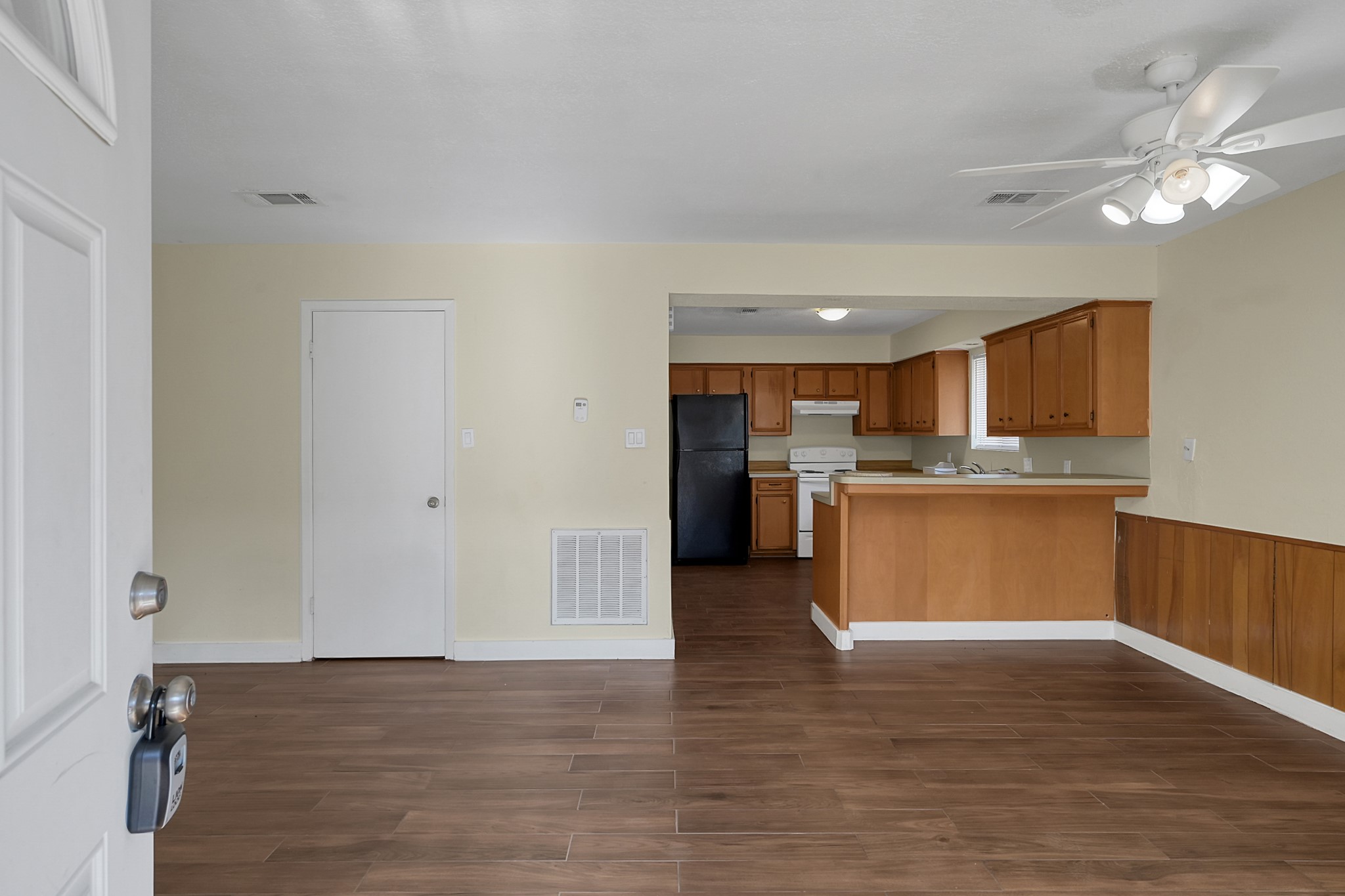 a view of kitchen with wooden floor