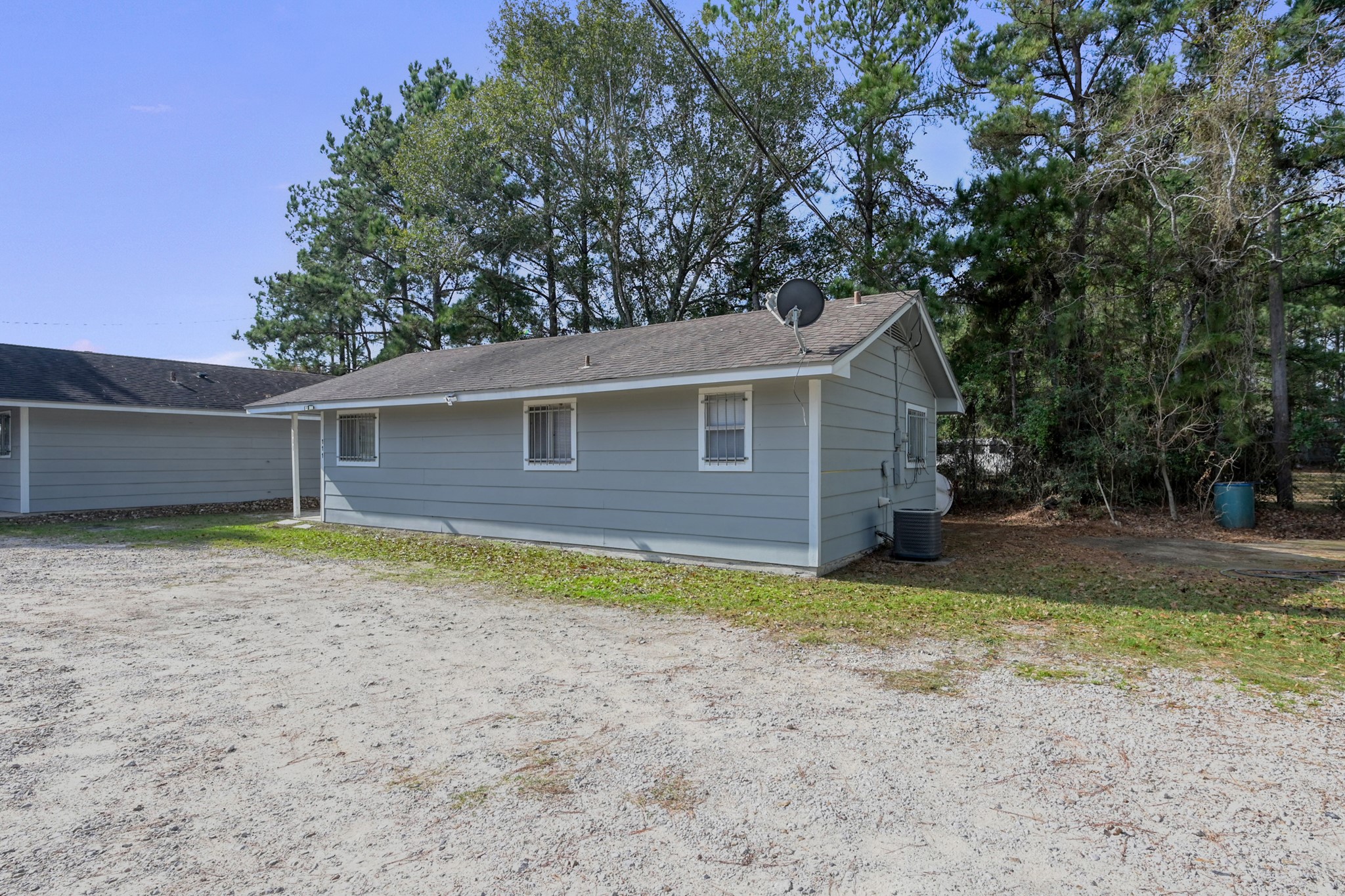 111 Cartwright Road Conroe, TX 77301 - Photo 17 of 19 a view of a house with a yard