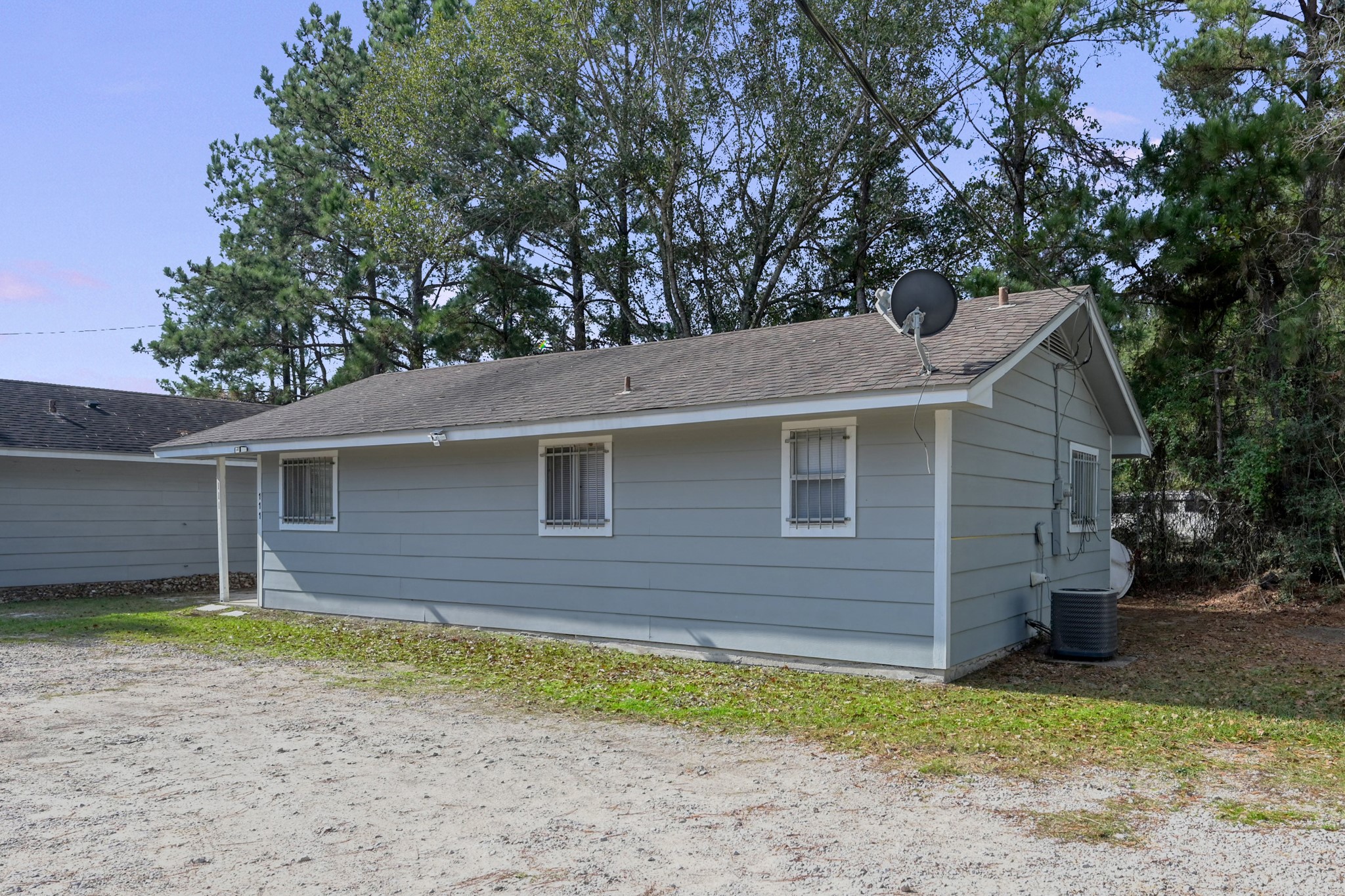 111 Cartwright Road Conroe, TX 77301 - Photo 18 of 19 a view of a house with a yard
