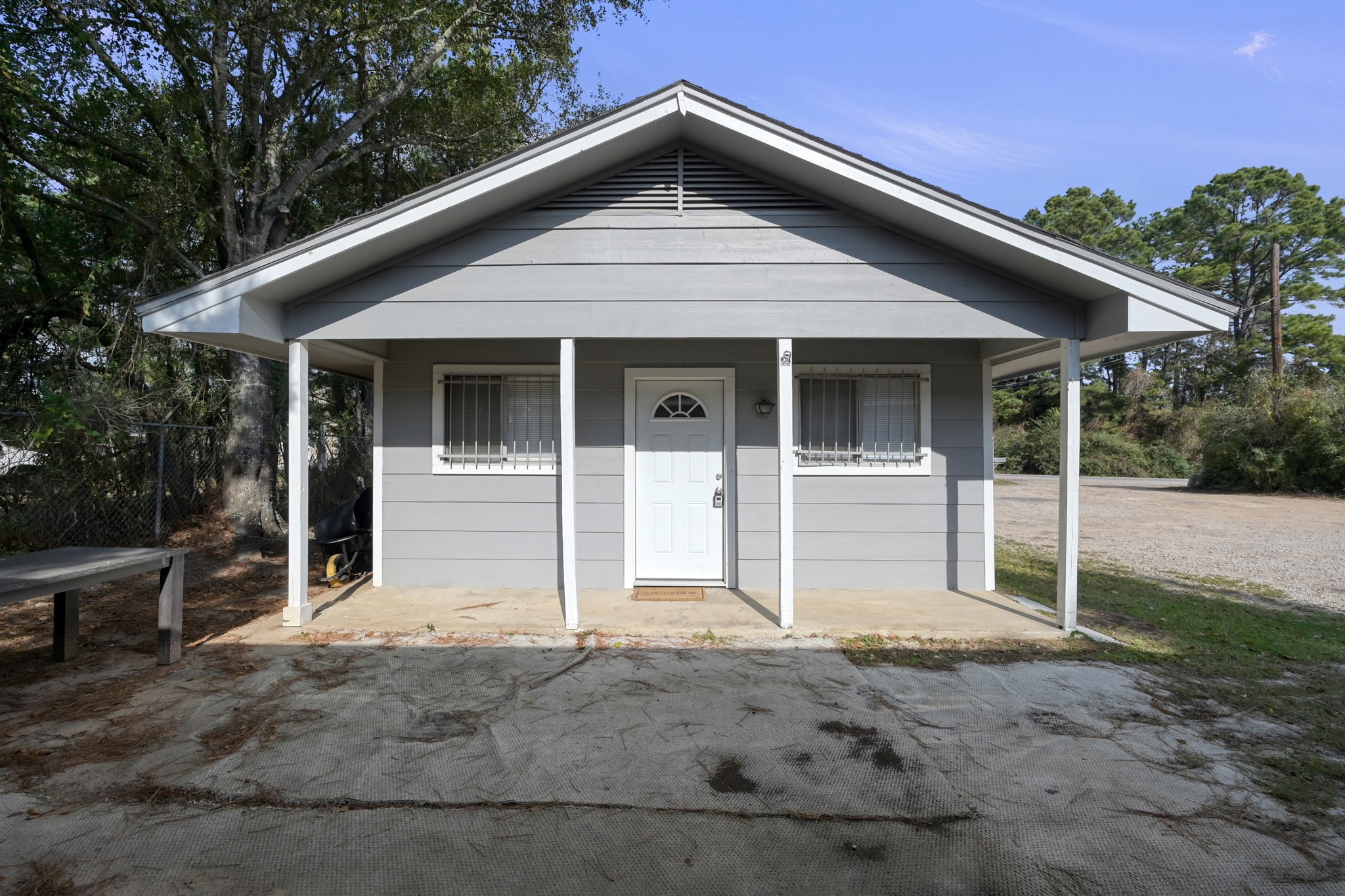 111 Cartwright Road Conroe, TX 77301 - Photo 4 of 19 a front view of a house with porch