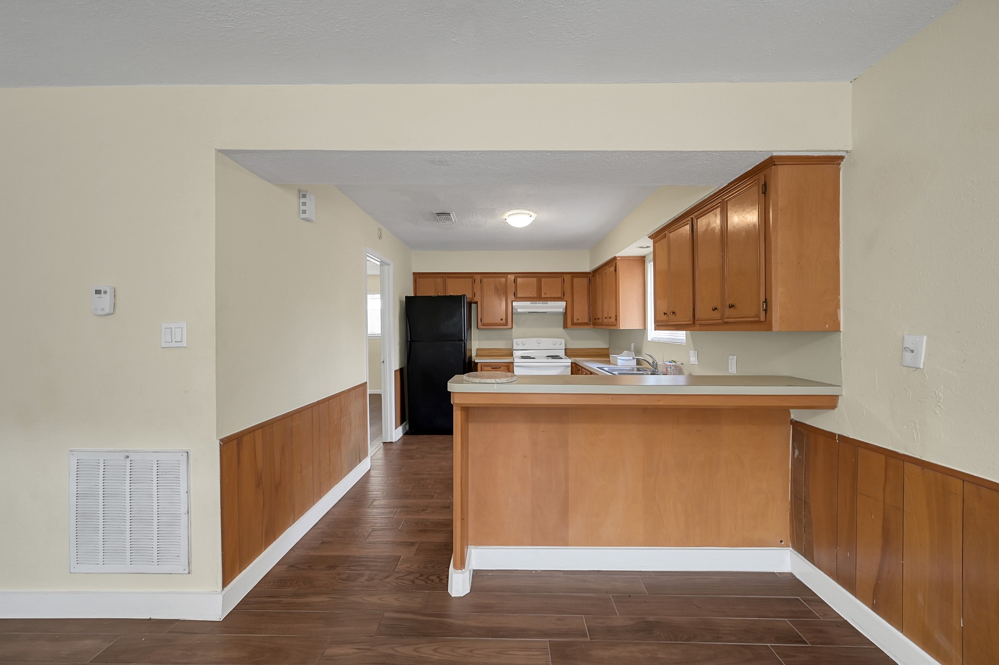 111 Cartwright Road Conroe, TX 77301 - Photo 10 of 19 a view of kitchen with wooden floor