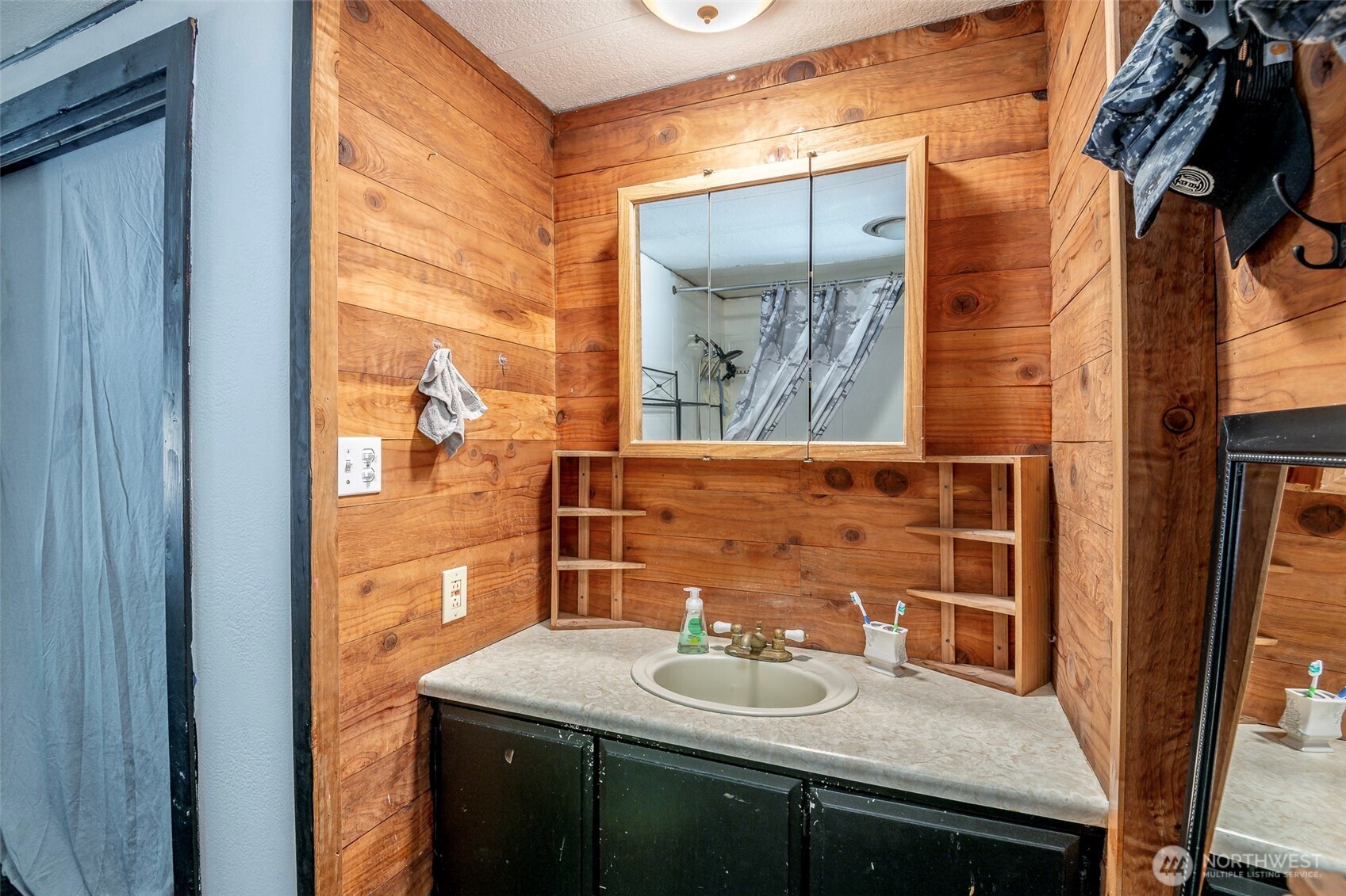 142 Gharet Road Randle, WA 98377 - Photo 21 of 32 a bathroom with a sink and a mirror