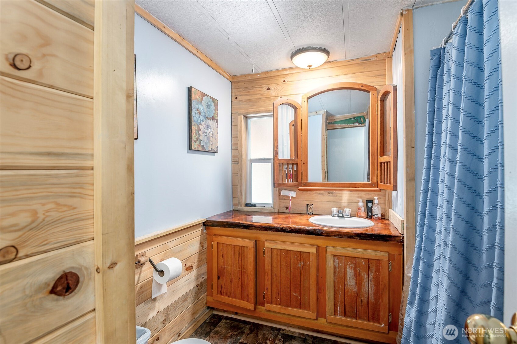 142 Gharet Road Randle, WA 98377 - Photo 22 of 32 a bathroom with a granite countertop sink and a mirror