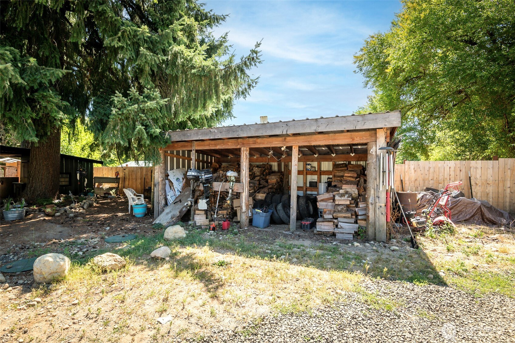 142 Gharet Road Randle, WA 98377 - Photo 25 of 32 a view of a chairs and table in a backyard