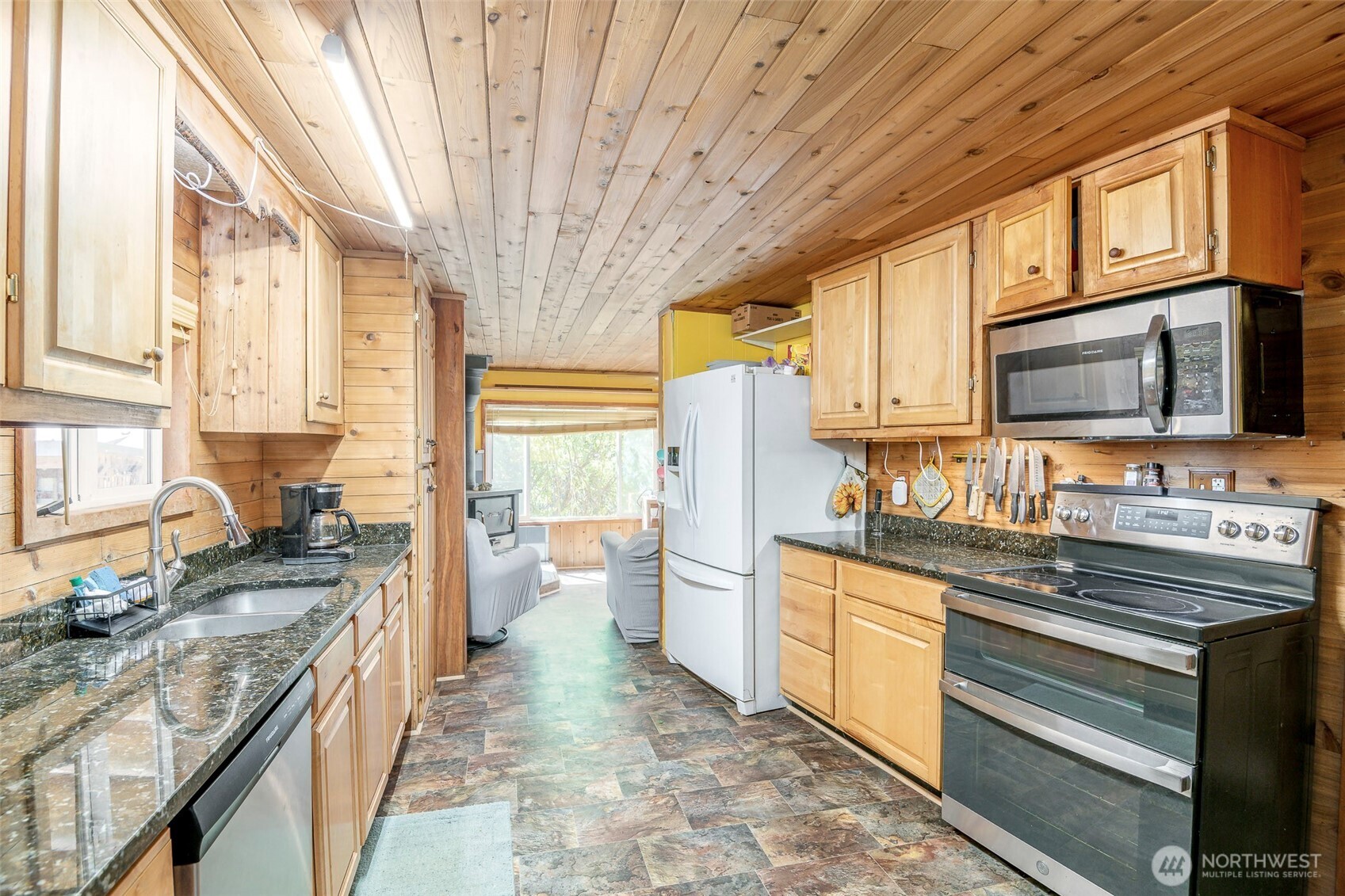 142 Gharet Road Randle, WA 98377 - Photo 4 of 32 a kitchen with stainless steel appliances a stove a sink dishwasher a refrigerator and a microwave