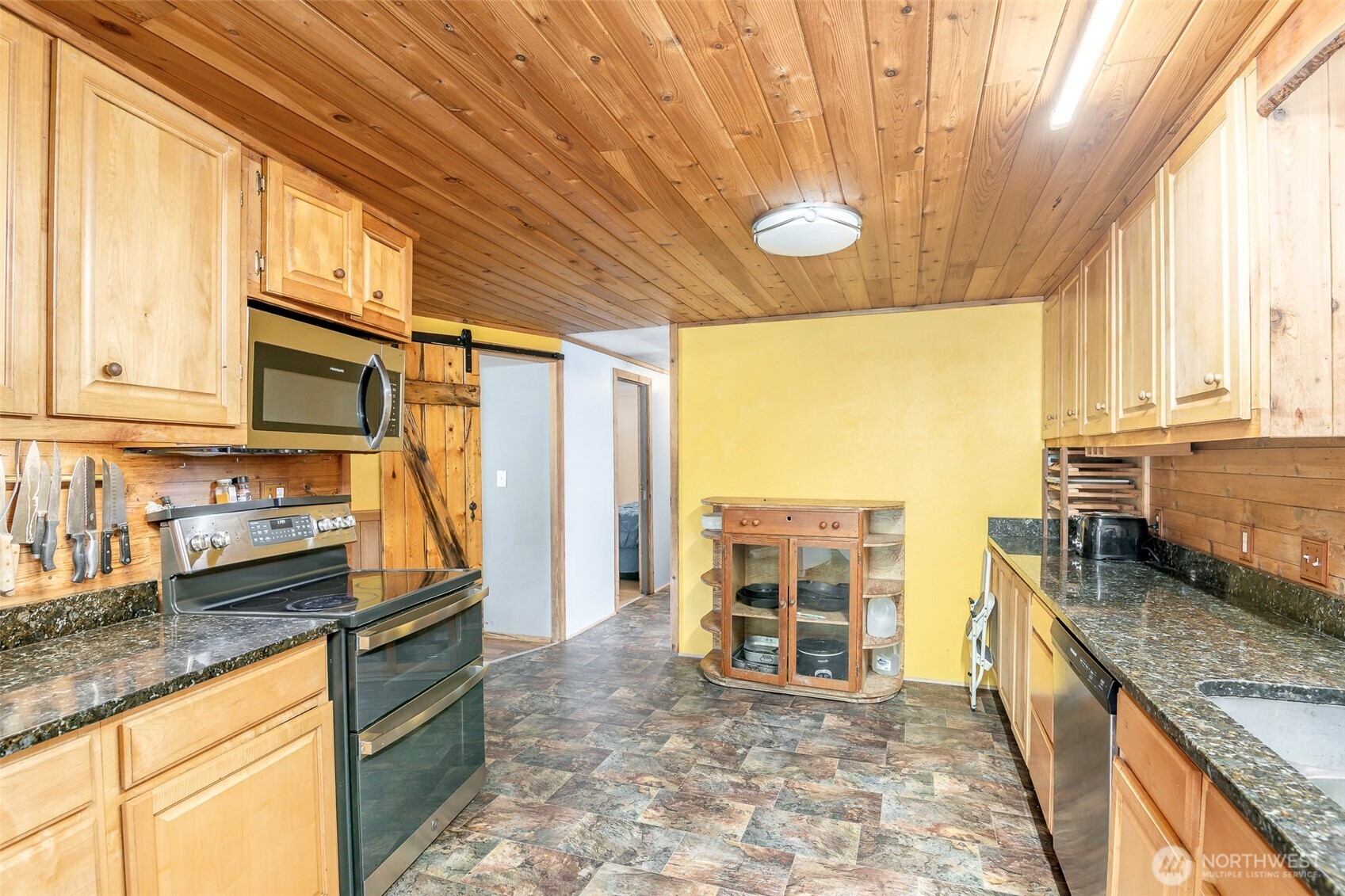 142 Gharet Road Randle, WA 98377 - Photo 5 of 32 a kitchen with stainless steel appliances granite countertop a stove a sink and a microwave