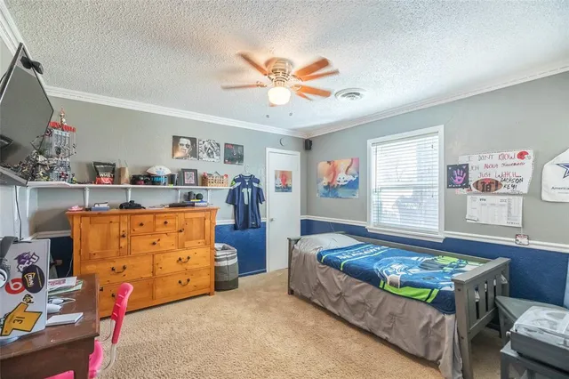 a bed room with a bed and a chandelier