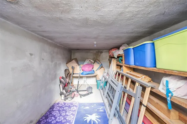 a view of a house with a yard and covered area