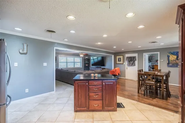 a kitchen with stainless steel appliances granite countertop a sink and cabinets