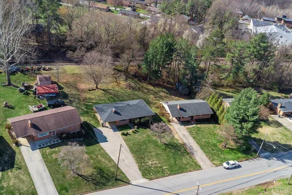 an aerial view of house with yard
