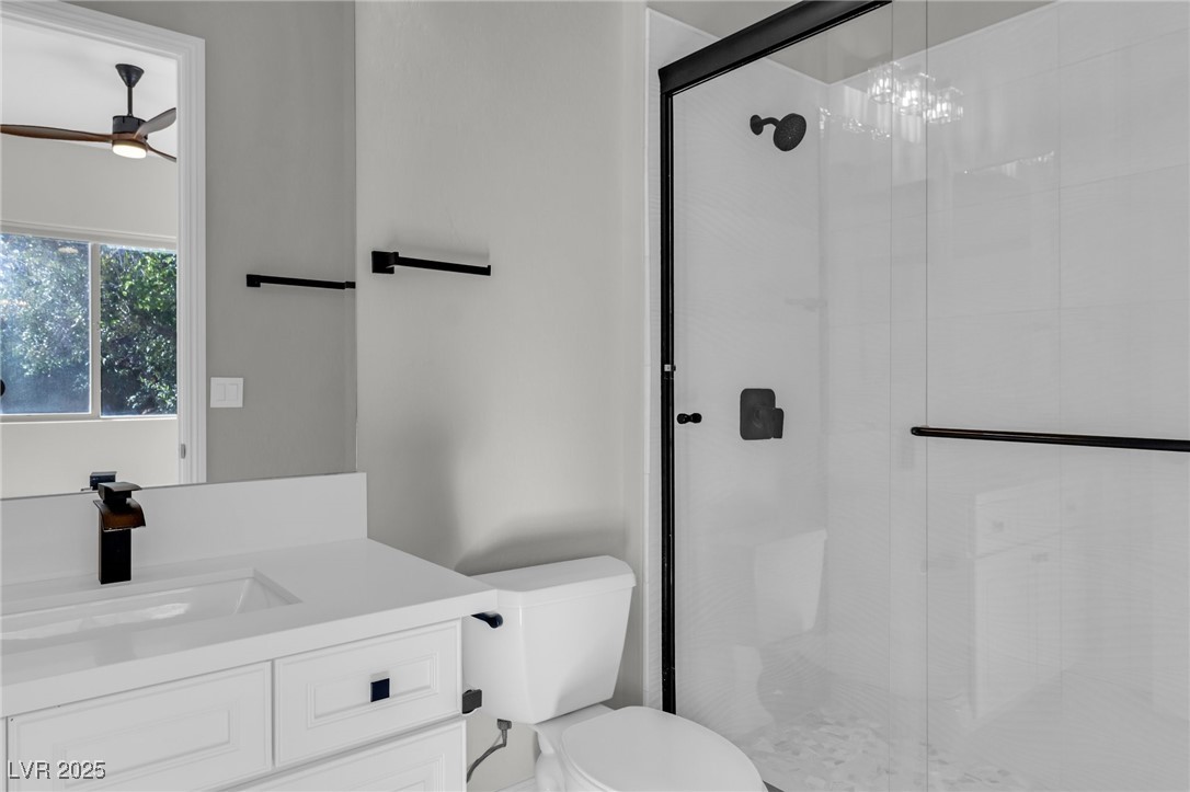 2805 Proust Court Henderson, NV 89044 - Photo 26 of 43 Full bath with toilet, double vanity, marble finish floor, and a sink