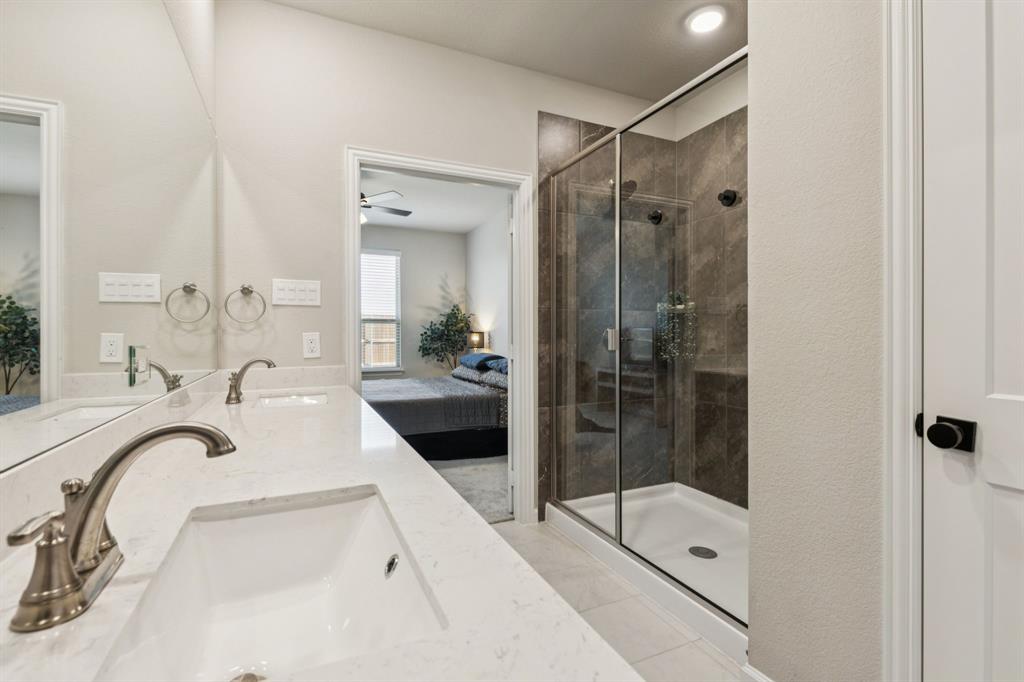 490 Tender Summit Lavon, TX 75166 - Photo 17 of 23 a bathroom with a tub sink mirror and shower