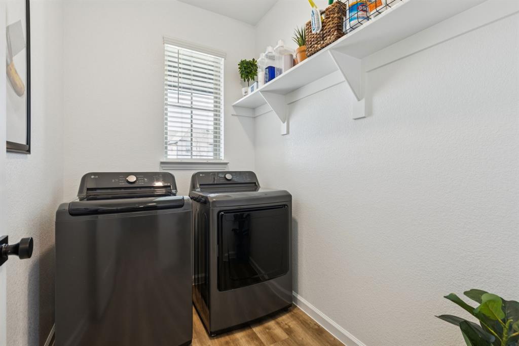490 Tender Summit Lavon, TX 75166 - Photo 2 of 23 a view of storage and utility room with washer and dryer