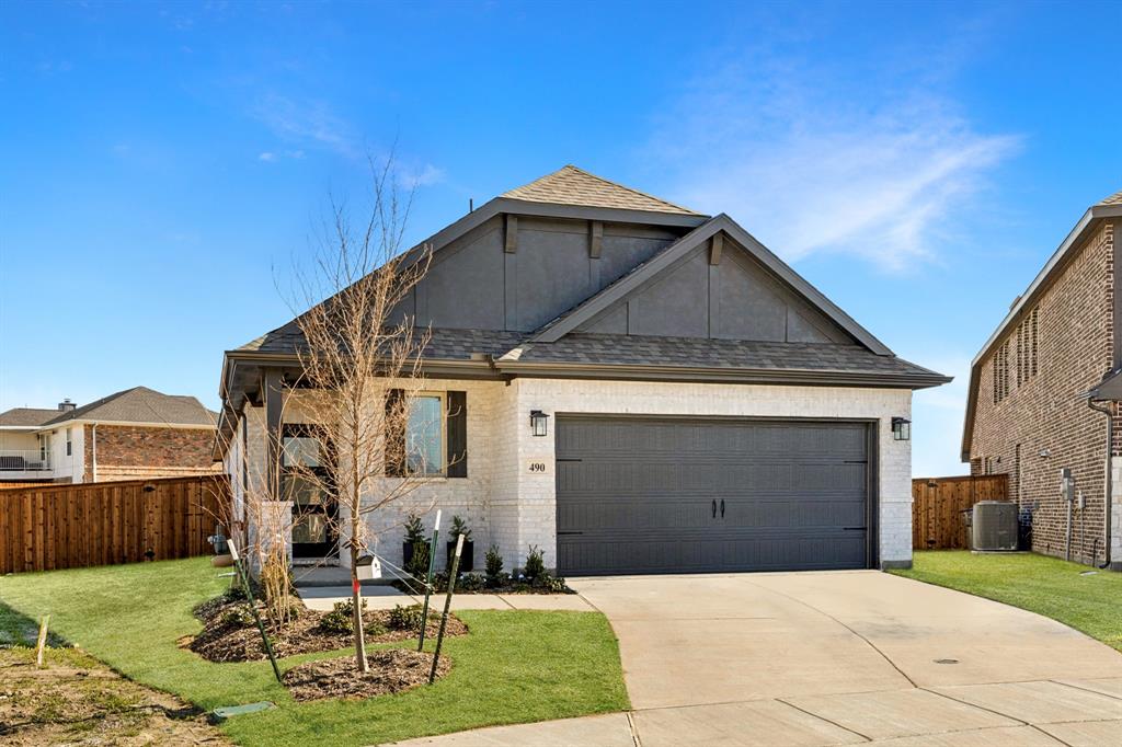 490 Tender Summit Lavon, TX 75166 - Photo 3 of 23 a front view of a house with garden