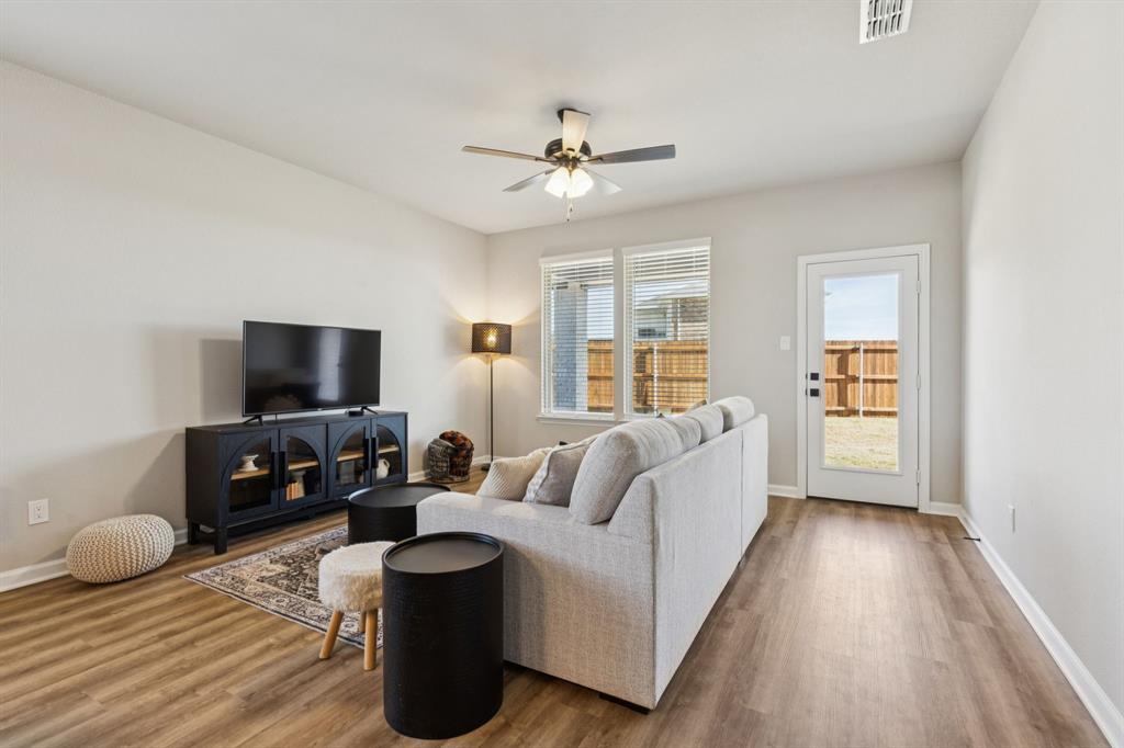 490 Tender Summit Lavon, TX 75166 - Photo 10 of 23 a living room with furniture and a flat screen tv