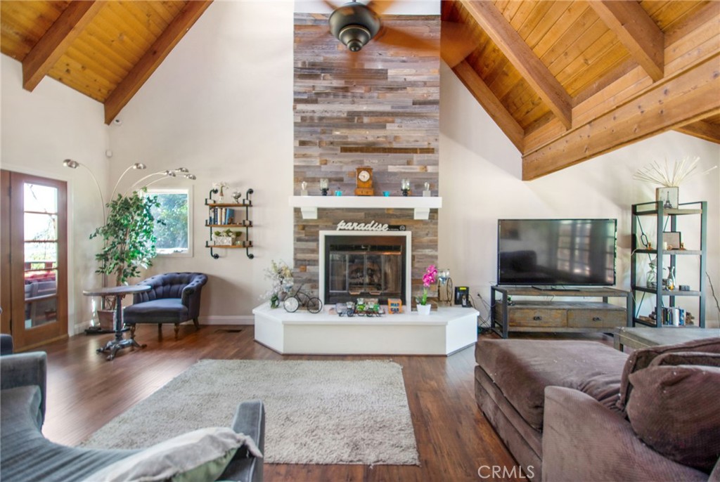 7241 Old Temescal Road Corona, CA 92881 - Photo 35 of 47 a living room with fireplace furniture and a flat screen tv
