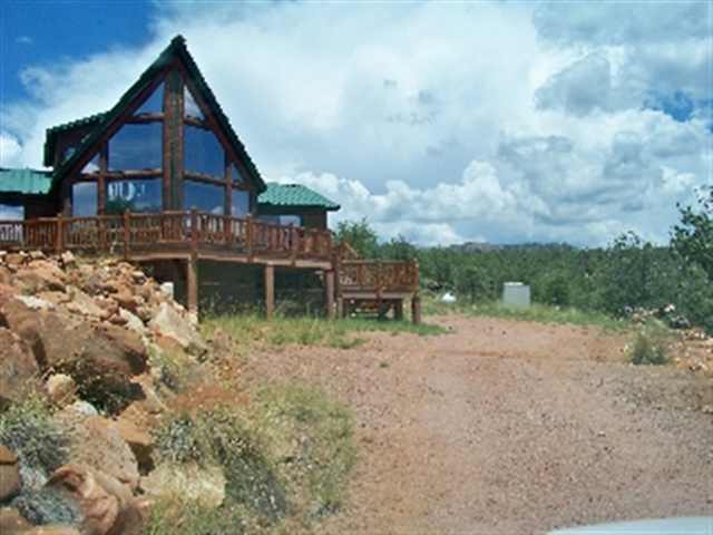 17 North Mountain View Road Payson, AZ 85541 - Photo 1 of 9 a backyard of a house with table and chairs