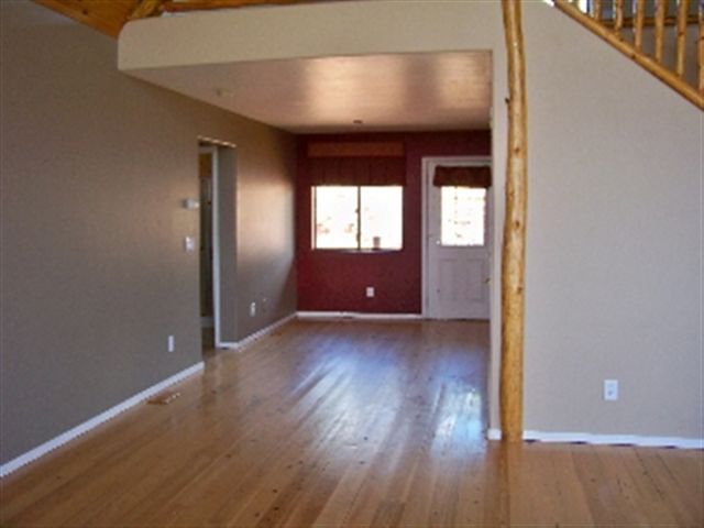 17 North Mountain View Road Payson, AZ 85541 - Photo 3 of 9 an empty room with wooden floor and windows
