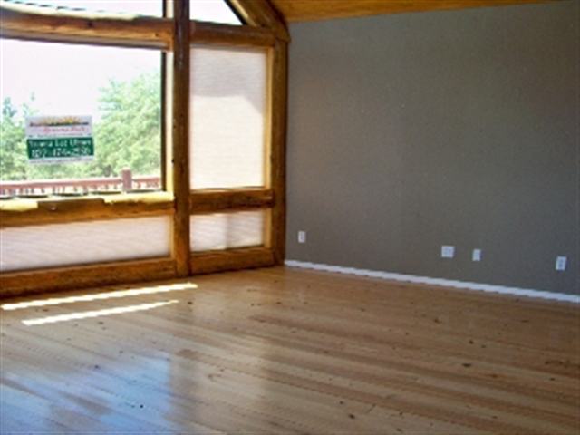 17 North Mountain View Road Payson, AZ 85541 - Photo 8 of 9 a view of an empty room with wooden floor and windows