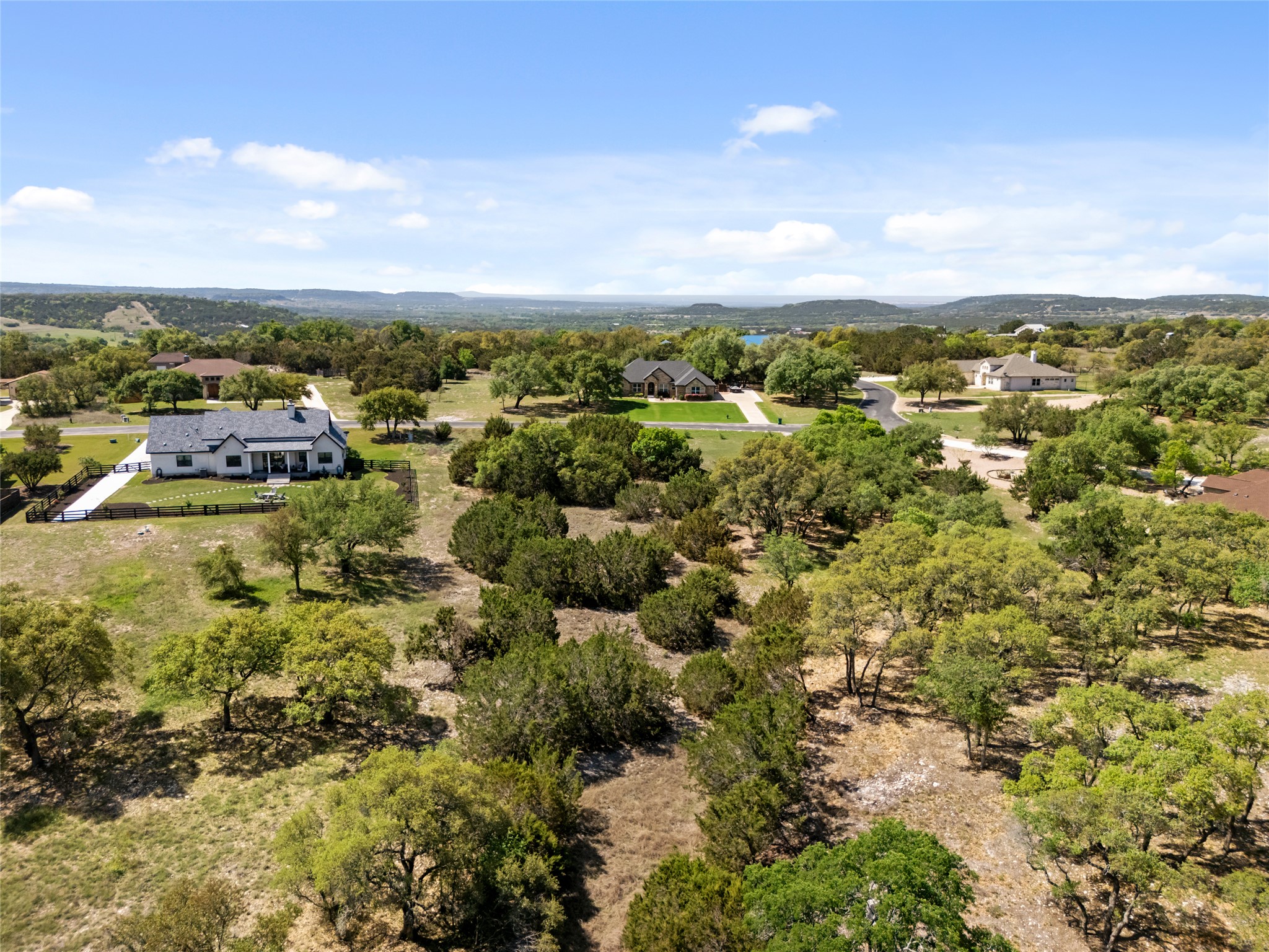 332 First Down Dash Burnet, TX 78611 - Photo 11 of 25 an aerial view of residential houses with outdoor space and trees
