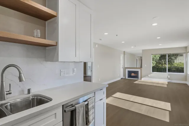 a kitchen with a sink and a refrigerator