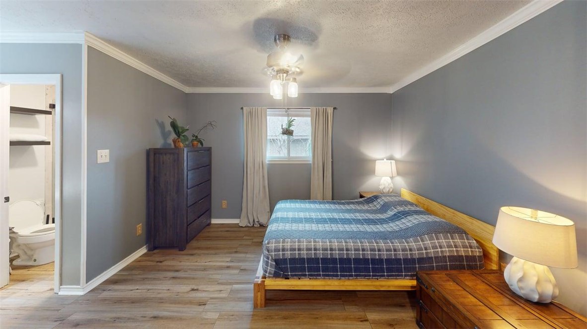 2108 Pantera Drive Bryan, TX 77807 - Photo 11 of 20 a bedroom with bed and wooden floor