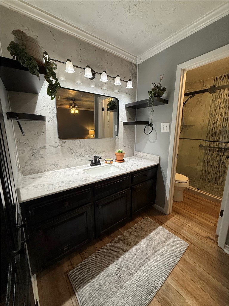 2108 Pantera Drive Bryan, TX 77807 - Photo 13 of 20 a spacious bathroom with a double vanity sink a mirror and shower