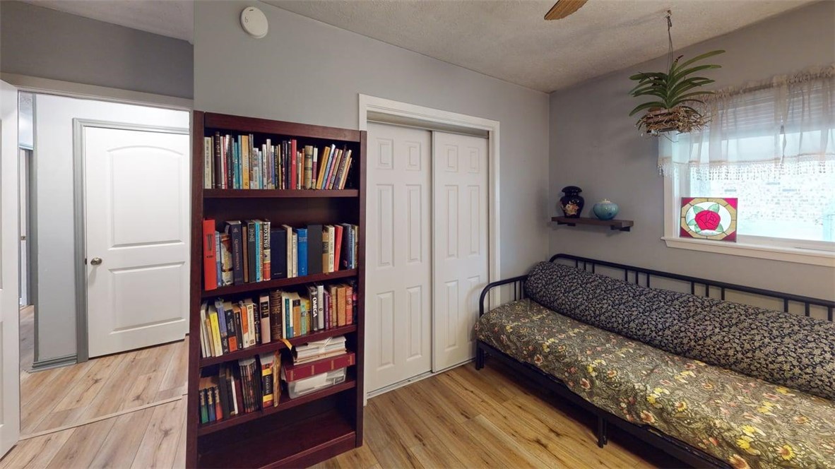2108 Pantera Drive Bryan, TX 77807 - Photo 16 of 20 a living room with lots of furniture and a book shelf